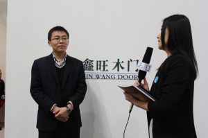 2013北京門展中國(guó)木門網(wǎng)專訪-鑫旺木門